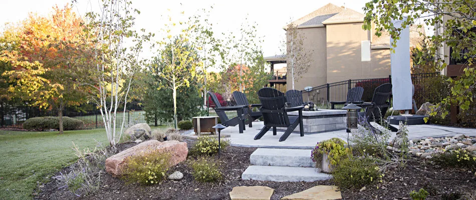 Luxury fire pit installed with patio and landscaping near Leawood, KS.